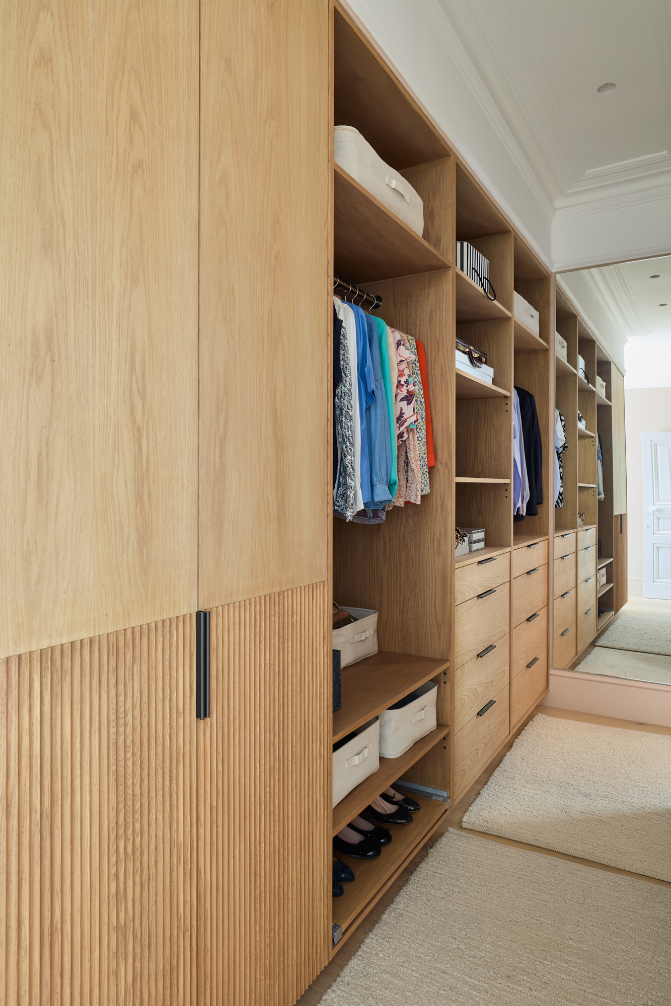 Bespoke full-height timber wardrobe with light warm-toned wood, open shelving and timber drawers